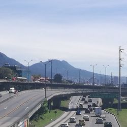 High angle view of cars on mountain against sky