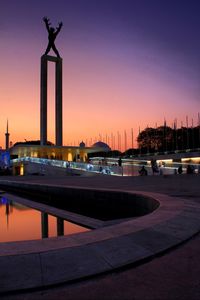 Monument of irian jaya liberation against sky during sunset