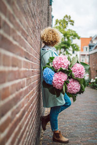 Rear view of woman holding bouquet