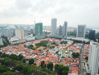 High angle view of city buildings against sky