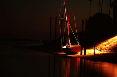 Boats in river at night