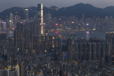 Aerial view of illuminated buildings in city at night