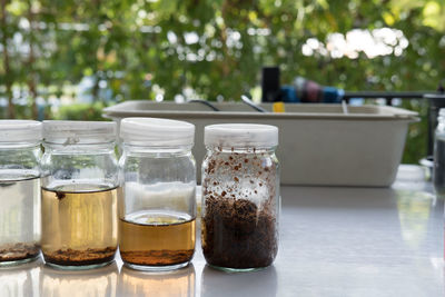 Close-up of drink in glass jar on table