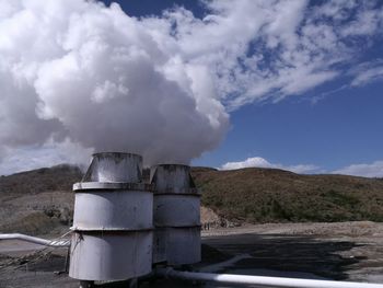 Built structure on landscape against sky