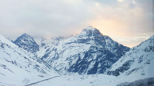 Snowcapped mountains against sky