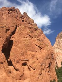 Low angle view of rock formation against sky