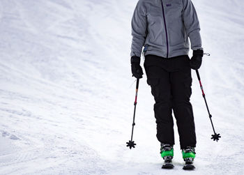 Full length of person skiing on snow covered land