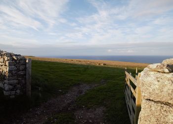 Scenic view of land against sky