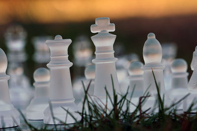 Chess pieces on grassy field