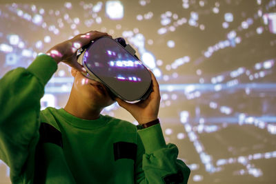 Young girl playing with virtual reality glasses