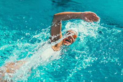 Female athlete swimming in pool