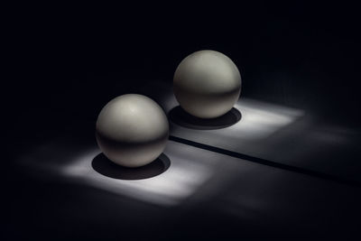 High angle view of balls on table against black background