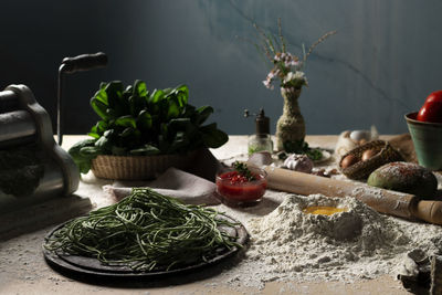 Pasta, spinach spaghettis on table