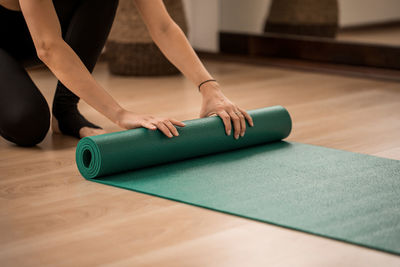 Low section of woman legs on table