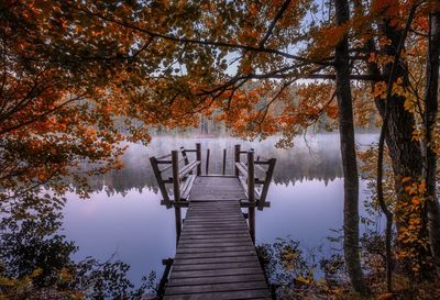 Wooden pier on lake during autumn