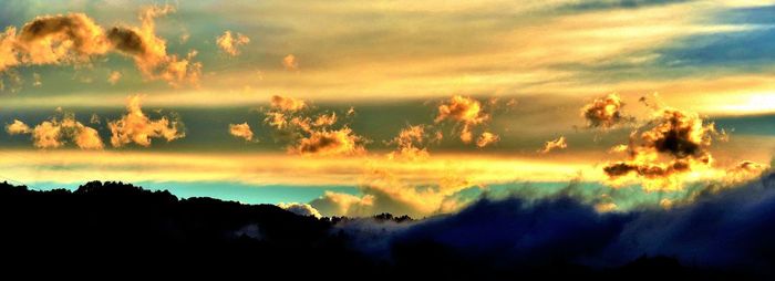 Low angle view of dramatic sky during sunset