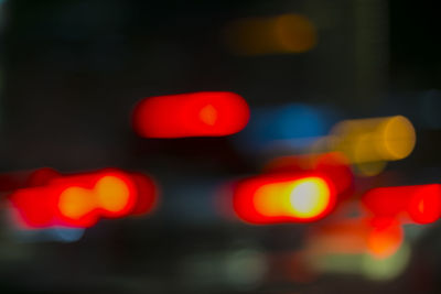 Defocused image of illuminated lights at night