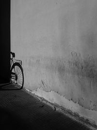 Bicycle parked on wall