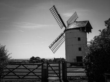 Traditional windmill against sky