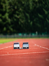 Starting blocks on the stadium treadmill in the summer