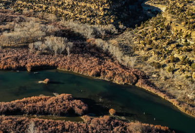 High angle view of rocks by lake