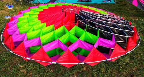High angle view of multi colored umbrellas on field