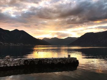 Scenic view of lake against sky during sunset