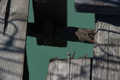 Close-up of birdhouse on wall against building