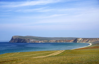 Scenic view of kolkhoz island against sky