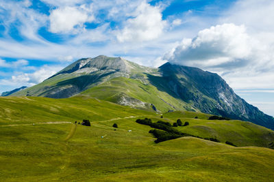 Scenic view of landscape and mountains against sky in arquata del tronto, marche italy 