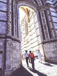 People standing outside temple