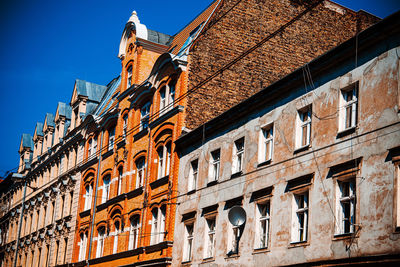 Low angle view of building against blue sky