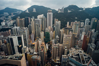 High angle view of modern buildings in city against sky