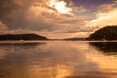 Scenic view of lake against sky during sunset