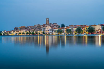 The townscape of the ancient village of marta, on the shore of the bolsena lake in italy