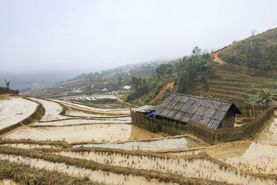 View of house amongst rice terraces in sapa, vietnam