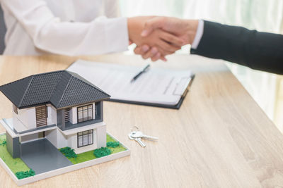 High angle view of people on table in building