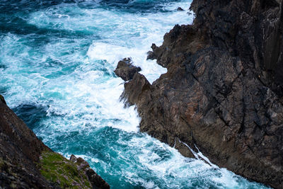 High angle view of rocks in sea