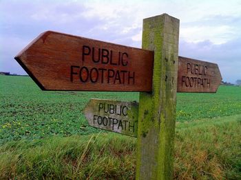 Information sign on grassy field