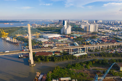 High angle view of bridge and buildings against sky