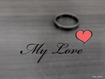 Close-up of heart shape text on paper