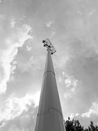 Low angle view of communications tower against sky