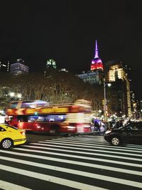 Traffic on road in city at night