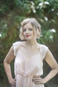 Portrait of young woman standing outdoors