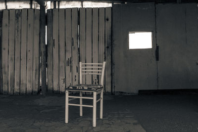 Empty chair in abandoned building