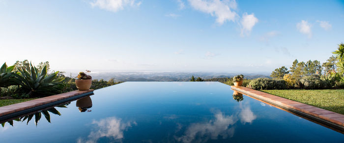 Panoramic view of infinity pool against landscape