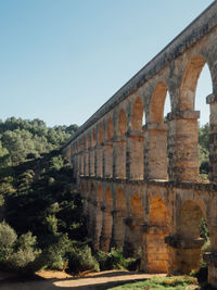 Aqueduct against clear sky