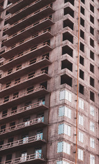 Close-up of a skyscraper with a view of the balconies, modern construction technology