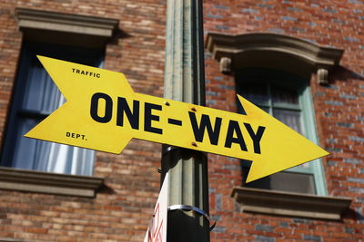 Low angle view of sign against building