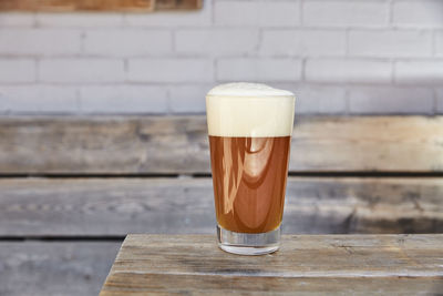 Close-up of beer glass on table